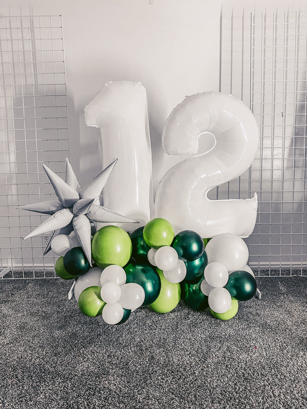 4 foot tall balloon bouquet featuring jumbo number balloons and a burst mylar balloon